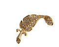 Broche af guldfarvet blad